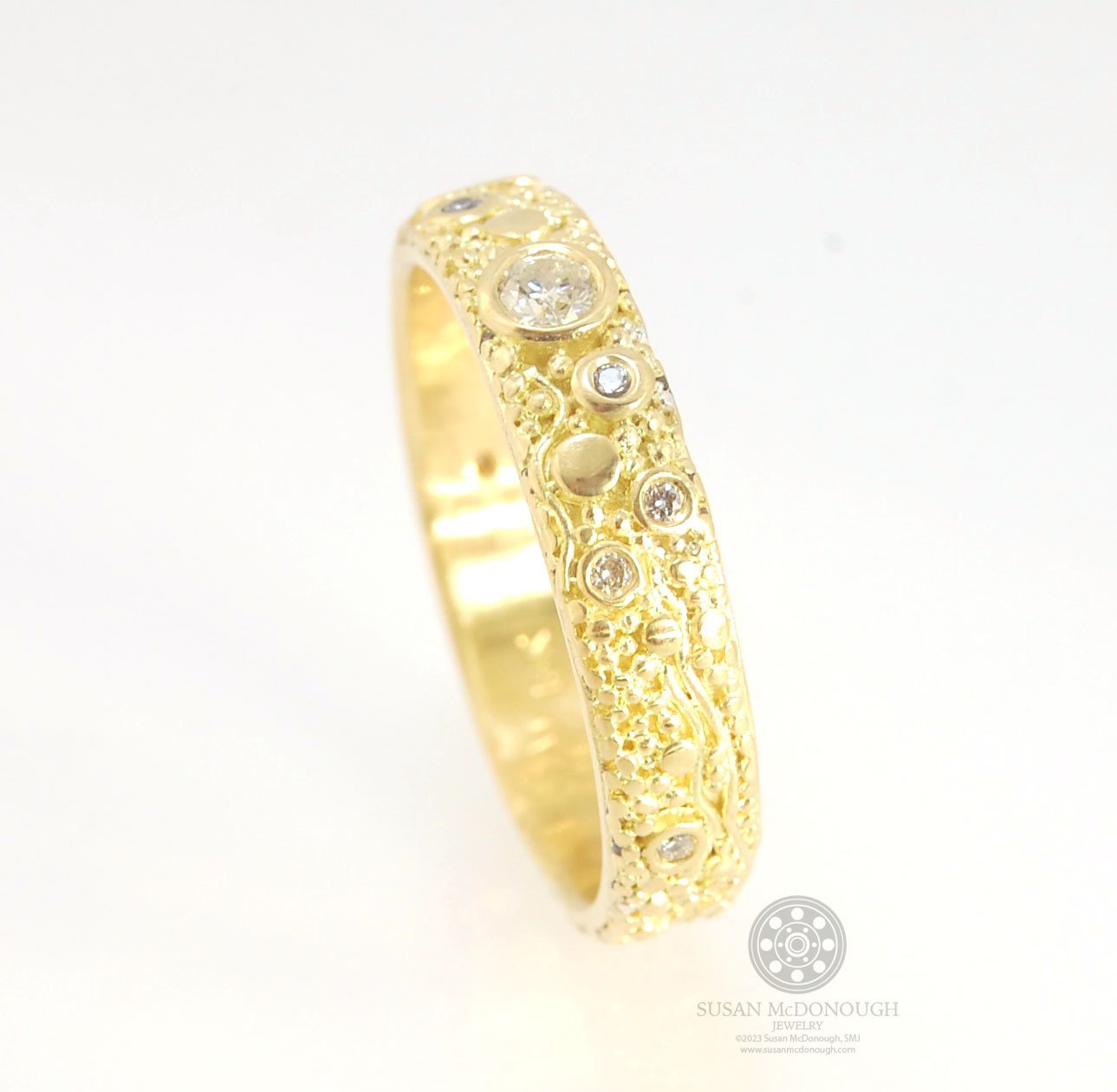 Balance and Flow Band 18k Granulation with 9 Diamonds - Made to Order This is a one-of-a-kind 18k gold and Diamond band made special just for you! The pattern is a balance of twining lines and granules and slices of cylinder ingots to make settings for ni