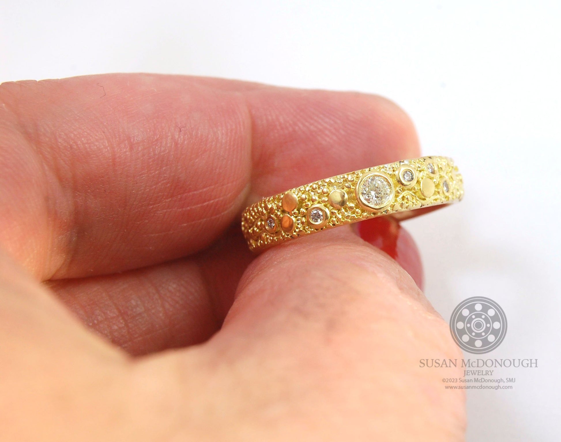 Balance and Flow Band 18k Granulation with 9 Diamonds - Made to Order This is a one-of-a-kind 18k gold and Diamond band made special just for you! The pattern is a balance of twining lines and granules and slices of cylinder ingots to make settings for ni