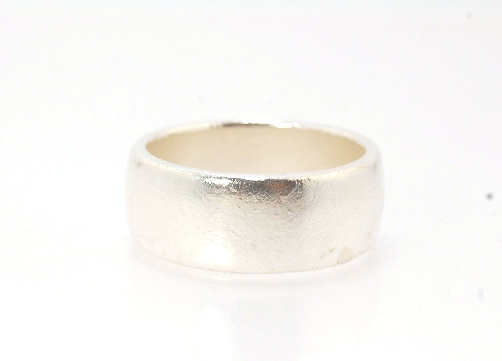 Real Wide Flat Half Round Band Ring in Sterling Silver This is a Real Wide Flat Half Round Band Ring cast from a wax carving. 8mm wide and 2.5mm thick, this ring was turned on a lathe in wax and cast using the lost wax process. These are so much fun to ma