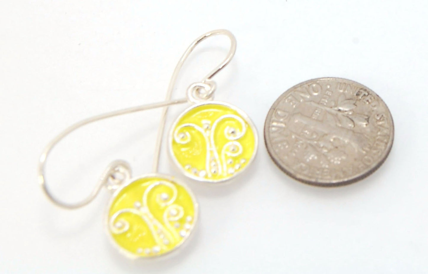 Daffodil Yellow Enameled Sterling Fern Circle Earrings - 12mm cast granulation,Enameled,Enameled earrings,fine silver granulation,silver,Yellow These small silver earrings are enameled in a bright pale yellow! These are cast from a wax mold of a granulate